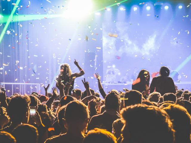 Young people dancing at night club - Hands up and multicolored confetti at nightclub after party - Nightlife concept with afterparty crowd celebrating dj concert festival event - Retro contrast filter